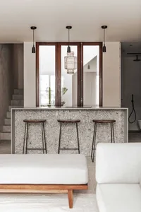 An overview of a modern kitchen interior with a floor plan, showcasing a terrazzo countertop.