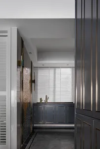 Modern industrial kitchen features metallic accents in a minimalist design.
