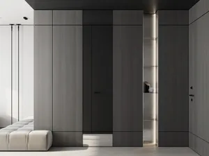 Modern, gray-wood wardrobe interior with minimal lighting and functional design elements.