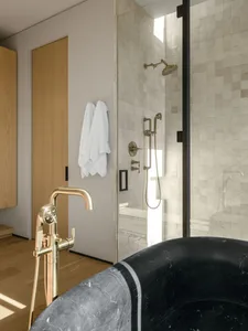 Modern bathroom interior featuring marble materials and contemporary fixtures.