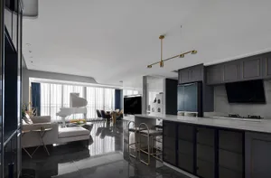 A modern kitchen with black marble flooring and cabinets