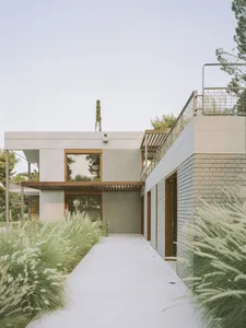 Modern house exterior with brick, concrete, and steel materials.