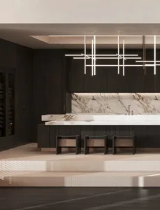 A modern kitchen with a marble countertop and wooden cabinets.
