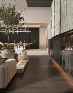 Modern living room with wooden floors, large stone wall, and olive tree centerpiece.