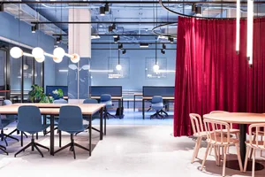 Modern office space with contemporary furniture, desks, and chairs.