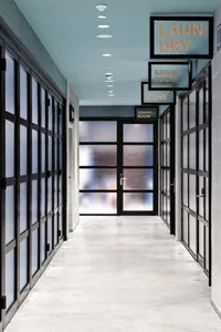 Modern office space with glass walls and a clean, minimalist design.