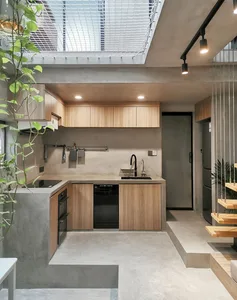 A modern kitchen designed with concrete materials.
