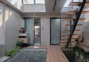 A modern retail storefront featuring concrete walls and floors.