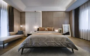 A minimalist bedroom with a textured finish, featuring a white blind, a pillow with intricate white lines, and a sculpture.