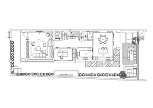 A detailed technical drawing of a residential interior with various functional zones and a garden area.