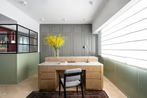 Modern office space featuring wood, glass, metal, and textiles
