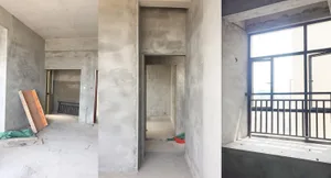一間空蕩、極簡的住宅室內空間，擁有混凝土牆面、地板與天花板。房間設有一扇單獨門口，一個 lar