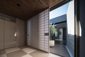 Modern interior space featuring a glass wall and open layout