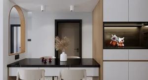 Minimalist kitchen with marble countertops, wooden cabinets, and metallic accents