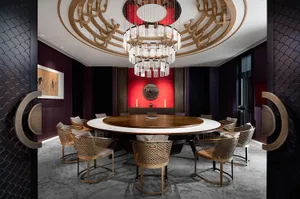 Modern dining room with wooden chairs and marble table