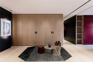 Modern living room with wooden furniture and minimalist design.