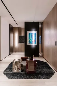 Modern living room featuring Scandinavian design elements with wood, metal, and acrylic materials.