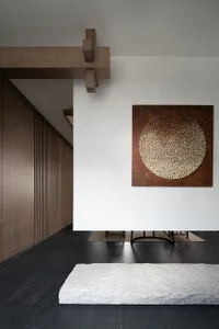 A modern interior space featuring wood paneling and a concrete floor