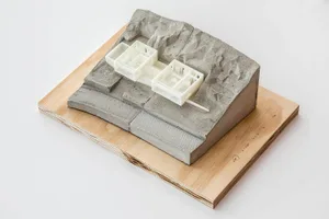 A model of a modern architectural design made of concrete.