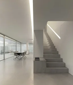Minimalist modern office with concrete staircase
