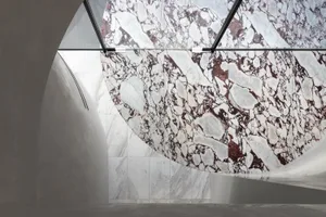 Modern interior space featuring marble walls and flooring