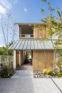 Modern house with a metal roof and wooden accents.