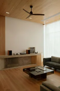 Minimalist modern living room featuring wood and brick materials
