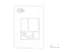 A detailed architectural floor plan of a residential building, featuring layout, rooms, and structural details.