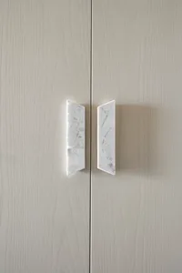 Modern cabinet featuring a marble handle detail.