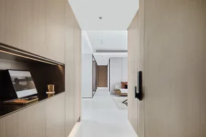 Modern bathroom with white walls, wooden cabinets, and a sleek minimalistic design.