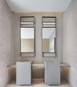 Modern bathroom with concrete sinks and mirrors