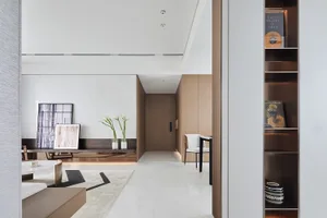 Modern residential interior with marble flooring, minimalist design, and sleek furniture.