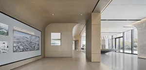 Modern, minimalist lobby with wooden materials and large windows.