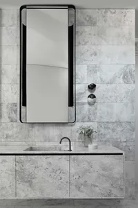 Modern marble bathroom with a sleek design and minimalist fixtures.