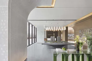 An interior design image of a modern office space featuring clean, minimalist design with concrete finishes and integrated LE