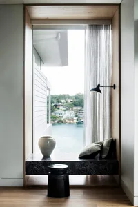 Modern interior with marble window ledge and view of water