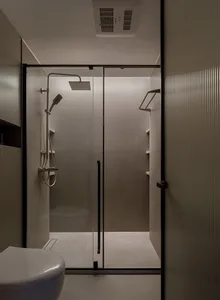 Modern bathroom featuring a glass shower enclosure with a sleek design.