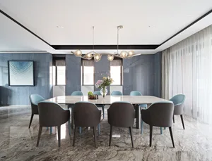Modern dining room featuring a marble table and chairs, with a stylish chandelier and large windows.
