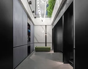 Modern interior corridor with concrete, marble, and wood materials