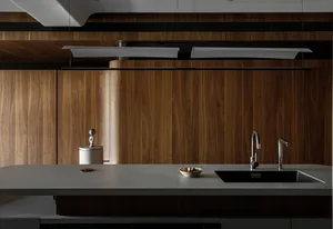 Modern interior design featuring wooden cabinets and a white countertop.