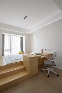 A modern minimalist bedroom with wooden furniture, a white bed, and gray curtains.