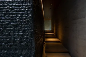 Minimalist indoor staircase made of polished concrete.