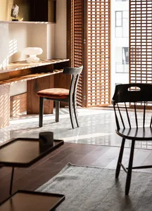 A modern living room featuring wood and marble materials.