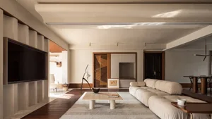 Modern residential living room featuring concrete and wood materials.