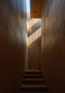 Wood paneling staircase in a minimalist interior design setting