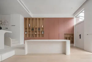 Minimalist living room with wooden furniture and pink laminate storage cabinets