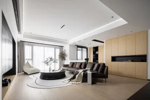 A modern living room with wooden furniture and leather accents.