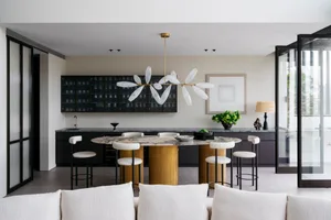 Modern kitchen featuring marble countertops and concrete finishes