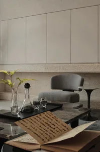 Modern interior design space featuring a marble coffee table and contemporary furniture.