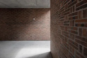 Modern interior design featuring brick walls and pavement